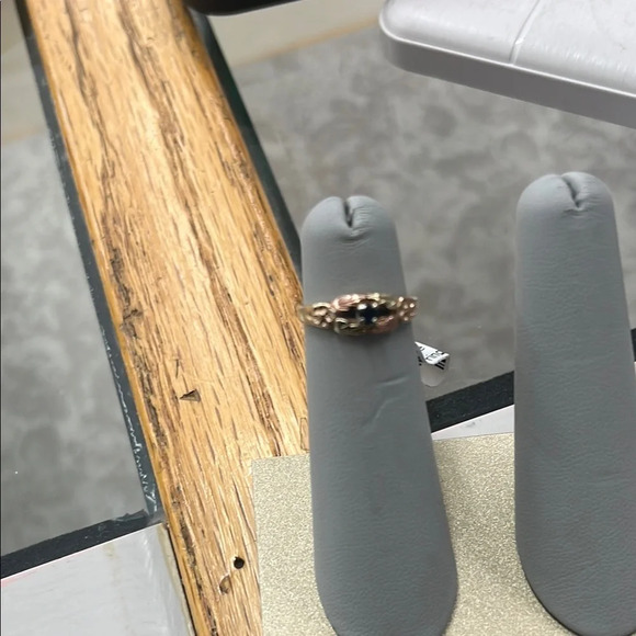 288983/052 10k black hills gold with a blue stone